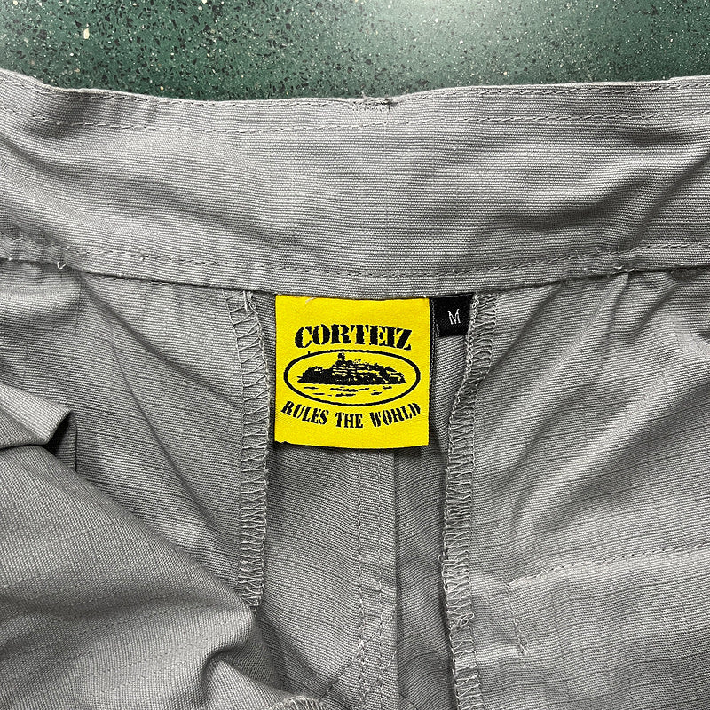 CORTEIZ CARGO PANTS STONE GREY Status Shipping