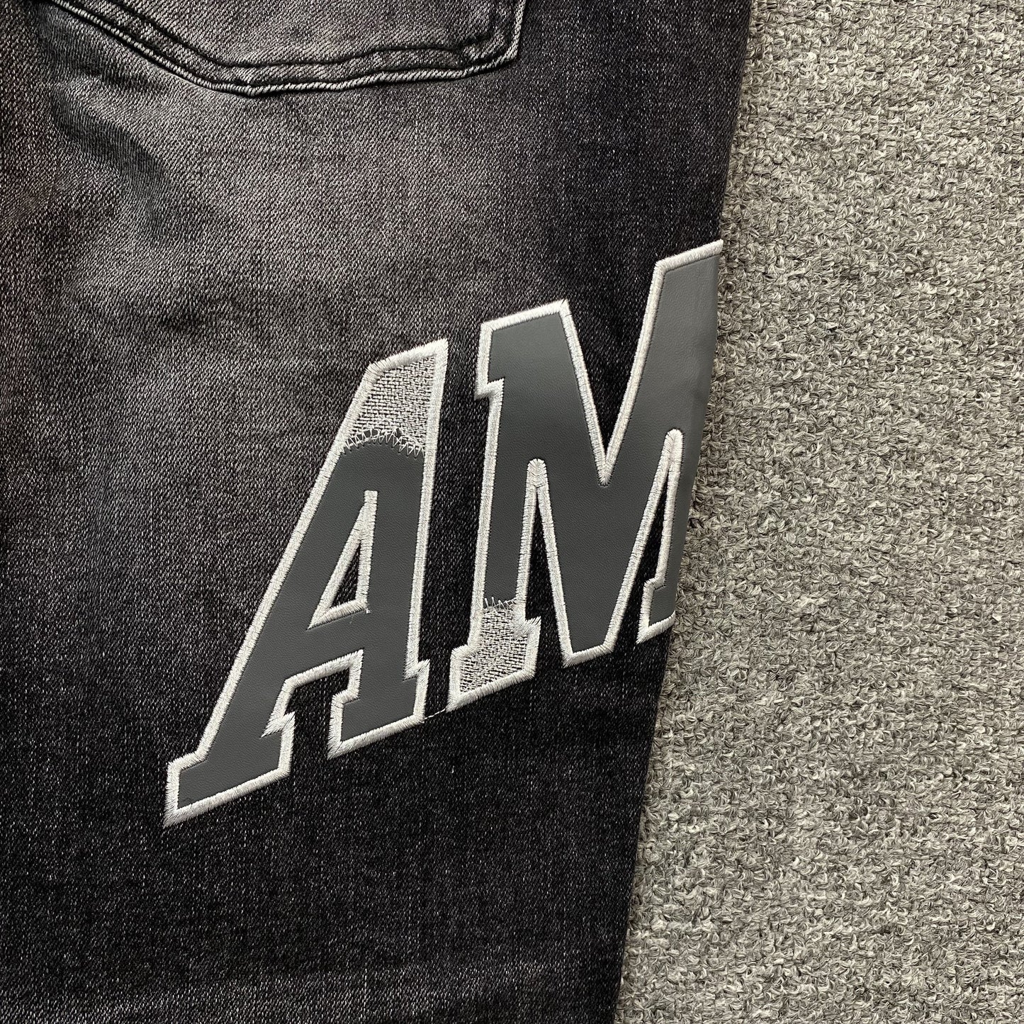 AMIRI VARSITY LOGO REPAIR JEANS Status Shipping