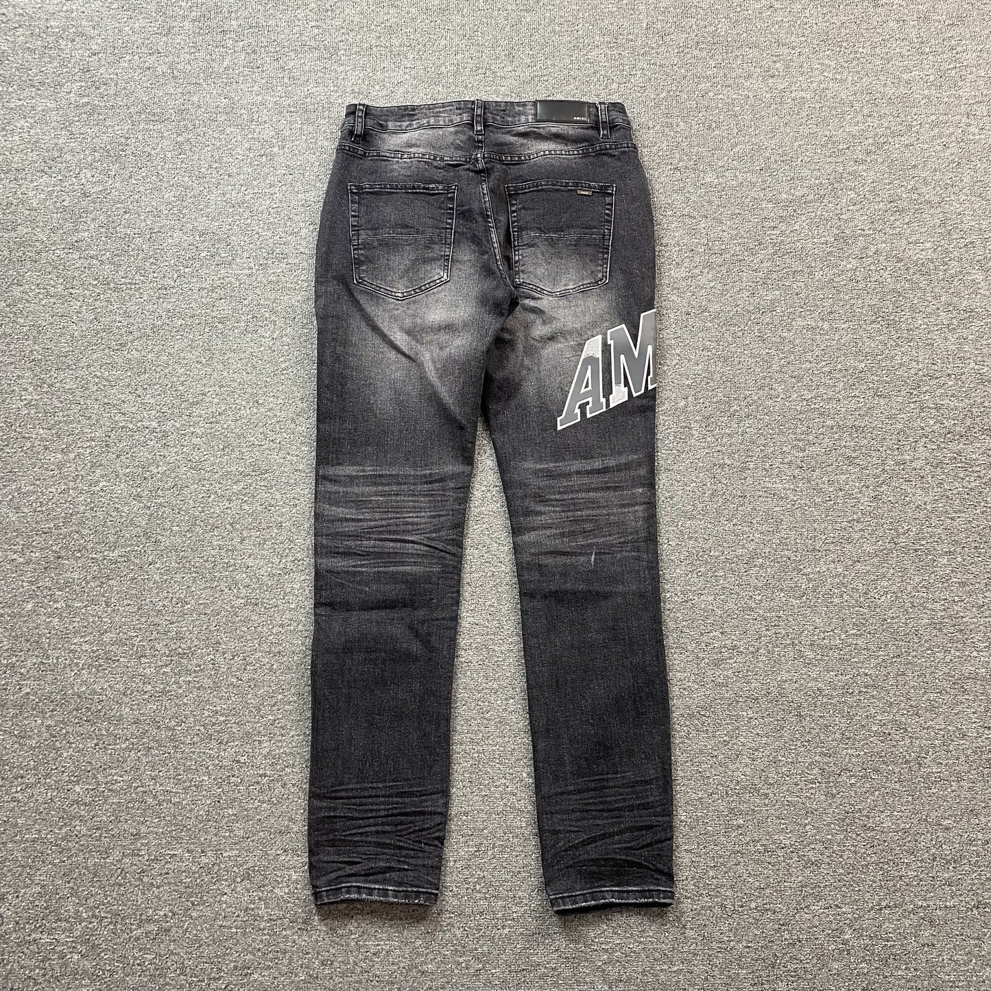 AMIRI VARSITY LOGO REPAIR JEANS Status Shipping