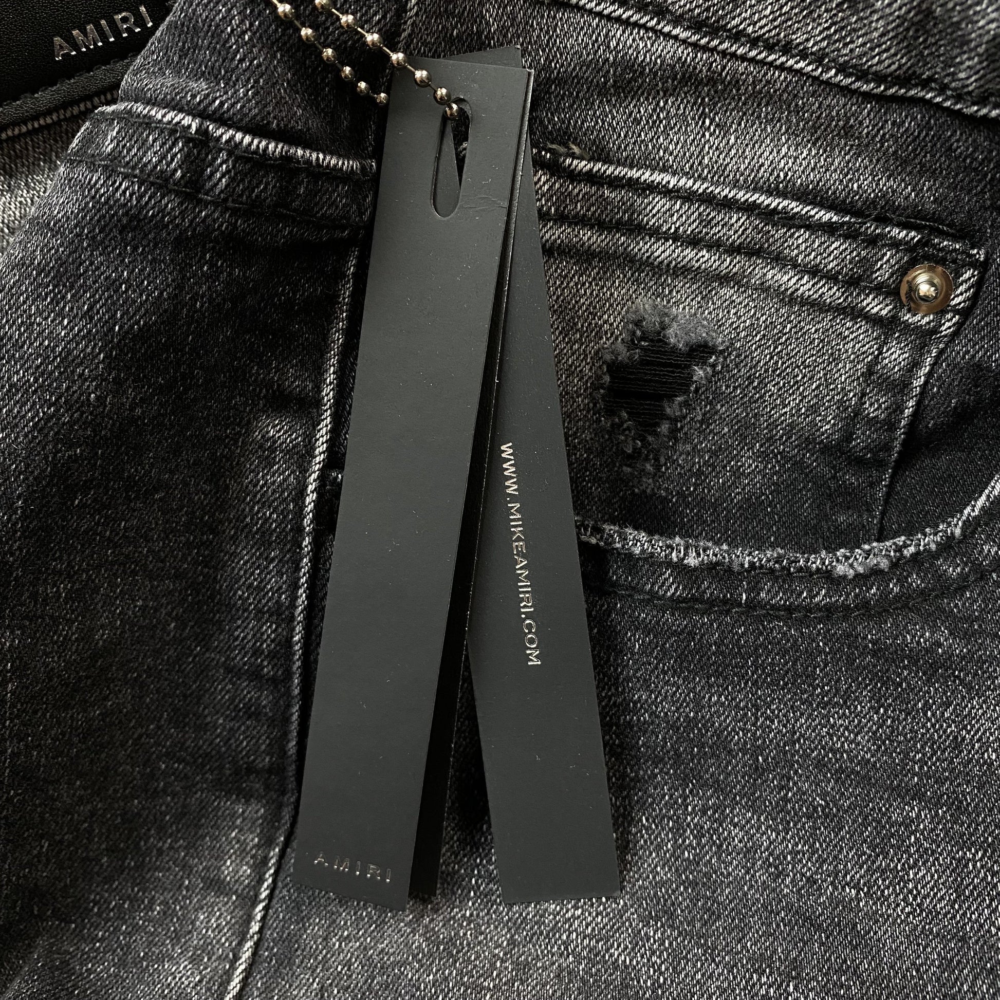 AMIRI VARSITY LOGO REPAIR JEANS Status Shipping