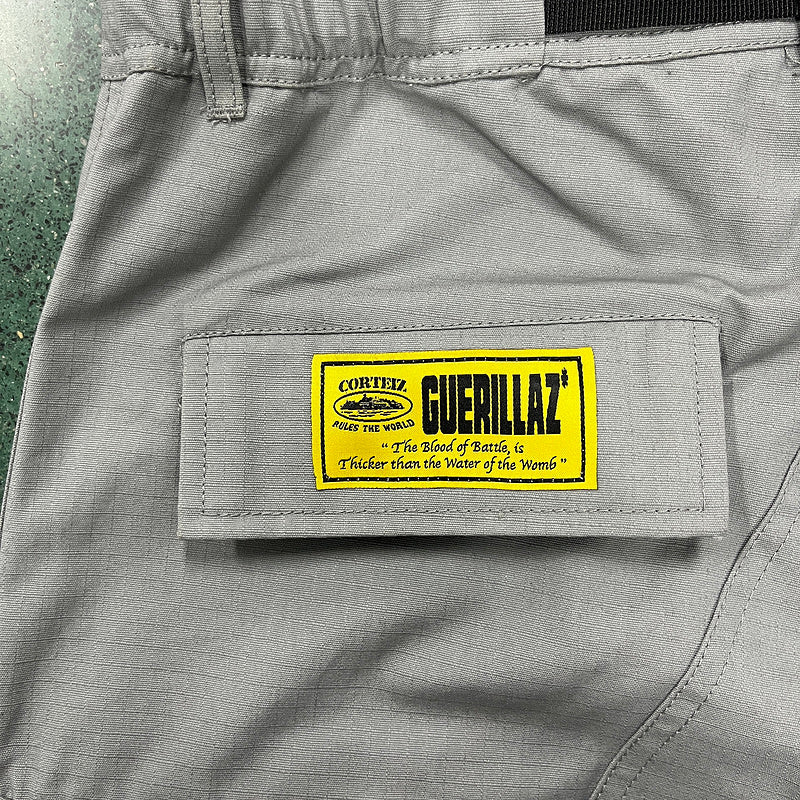 CORTEIZ CARGO PANTS STONE GREY Status Shipping